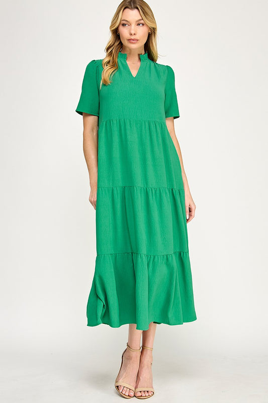 Front view Boutique solid colored ruffle neck maxi dress in green